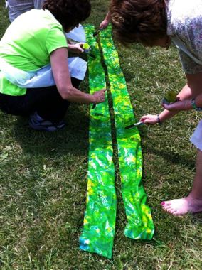 Students painting green banners.  It could be so meaningful to paint fire red banners Confirmation retreat and then use those banners at the actual 
Confirmation