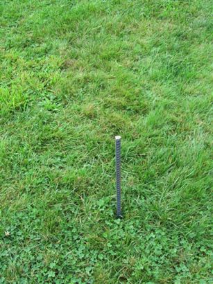 2' rebar stake pounded nearly half-way into the ground